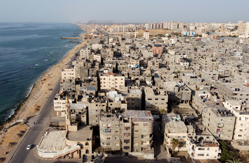 This photograph taken with a drone shows Palestinian houses and buildings at the Beach refugee camp in Gaza City on April 7, 2021.