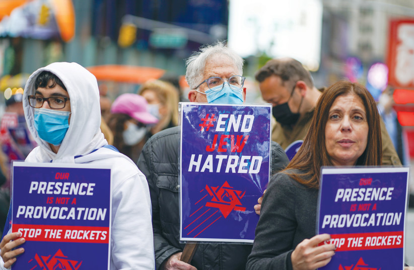 PEOPLE DEMONSTRATE against antisemitism and in support of Israel at a rally in New York City’s Times Square in May. (photo credit: REUTERS/DAVID 'DEE' DELGADO)
