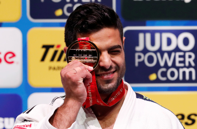 Israel's Sagi Muki poses with his gold medal on the podium at the World Judo Championships, 2019. (credit: REUTERS/KIM KYUNG-HOON)