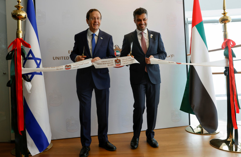 UAE Ambassador to Israel, Mohamed Al Khaja, and Israeli President Isaac Herzog cut a ribbon during the opening ceremony of the Emirati embassy in Tel Aviv, Israel July 14, 2021. (photo credit: AMIR COHEN/REUTERS)