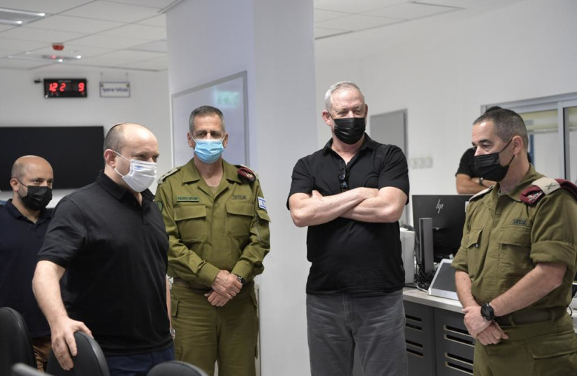  PM Naftali Bennett, IDF Chief of Staff Lt. -Gen. Aviv Kohavi and Defense Minister Benny Gantz at a situation assessment tour at the Gaza Division, August 17, 2021 (photo credit: KOBI GIDEON/GPO)
