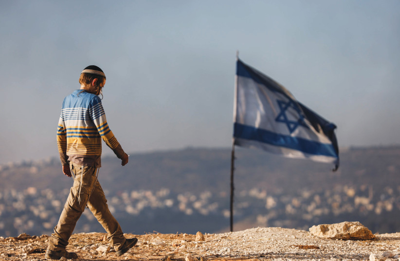  A JEWISH teenager in Givat Evyatar, near the Palestinian village of Beita. (credit: AMIR COHEN/REUTERS)