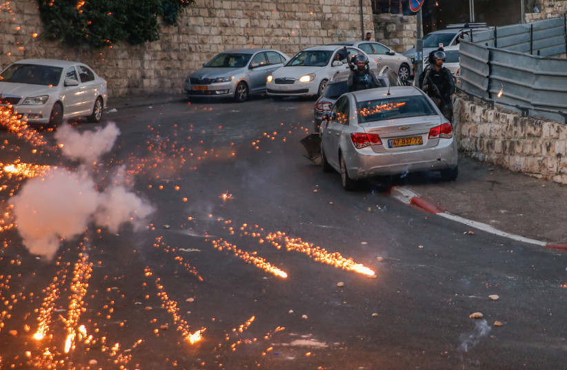  Protesters clash with Israeli police forces after a shop was demolished by Israeli authorities in the East Jerusalem neighbourhood of Silwan, on June 29, 2021.  (credit: JAMAL AWAD/FLASH90)