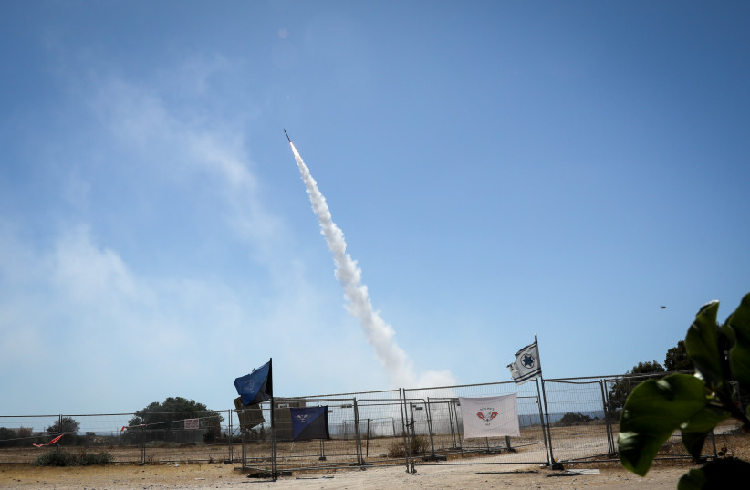  Iron dome anti-missile system fires interception missiles as rockets fired from the Gaza Strip to Israel, in the southern Israeli city of Ashkelon, May 19, 2021.  (photo credit: OLIVIER FITOUSSI/FLASH90)