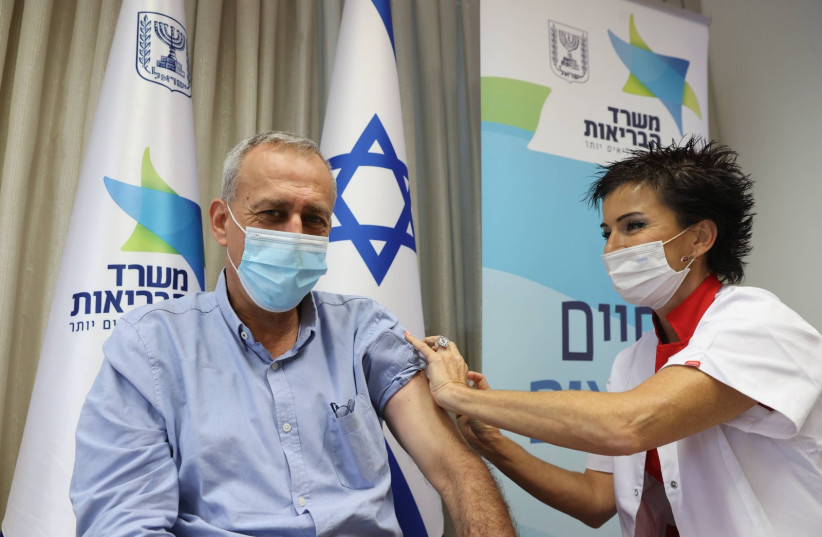 Health Ministry D-G Nachman Ash receiving a flu vaccine on October 17, 2021 (photo credit: HEALTH MINISTRY)