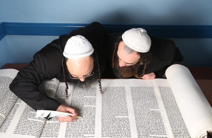  SCRIBES FINISH writing a Torah scroll. (credit: DAVID COHEN/FLASH 90)