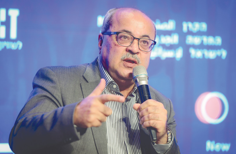  MK AHMAD TIBI addresses the ‘Haaretz’ conference in Jaffa on Tuesday.  (credit: AVSHALOM SASSONI/FLASH90)