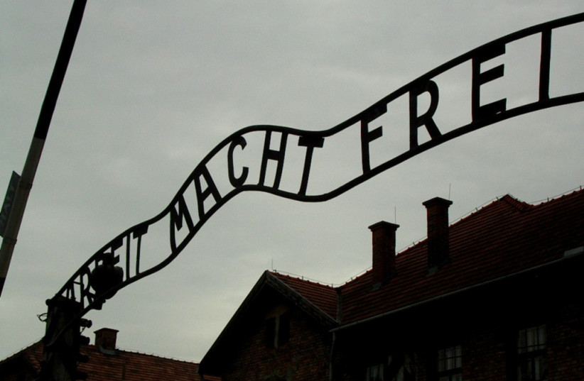  Entrance gate at Auschwitz concentration camp (credit: VIA WIKIMEDIA COMMONS)