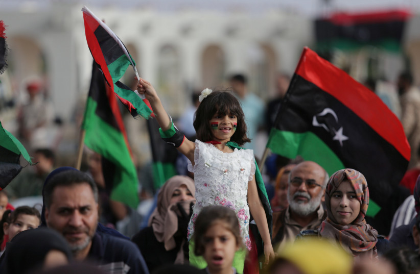  A girl holds a Libyan flag during celebrations marking the third anniversary of Libyan National Army's ÒDignityÓ operation against Islamists and other opponents, in Benghazi, Libya May 16, 2017 (credit: ESAM OMRAN AL-FETORI/REUTERS)