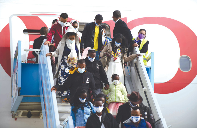  ETHIOPIANS ARRIVE on aliyah at Ben-Gurion Airport earlier this year. Ethiopian aliyah constitutes a crucial moral issue for the Jewish people. (credit: TOMER NEUBERG/FLASH90)