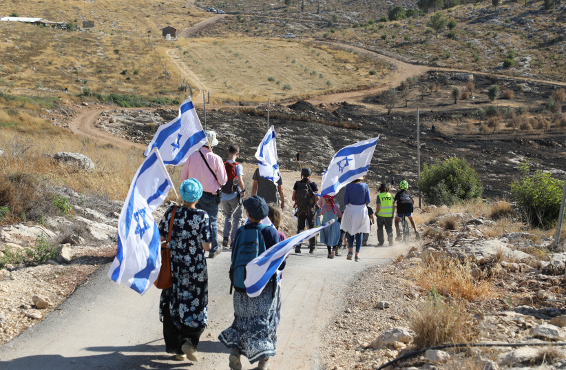  MARCHING WITH signs reading ‘preserving and saving the Israeli land,’ in Bat Ayin and Gush Etzion junction, June 21.  (credit: GERSHON ELINSON/FLASH90)
