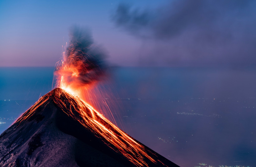  A volcano, Volcan de Fuego, is seen erupting in Guatemala (illustrative). (credit: Alain Bonnardeaux/Unsplash)