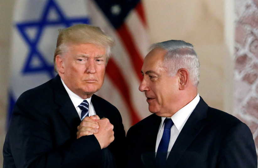 US President Donald Trump and Israeli Prime Minister Benjamin Netanyahu shake hands after Trump's address at the Israel Museum in Jerusalem (credit: REUTERS/Ronen Zvulun)