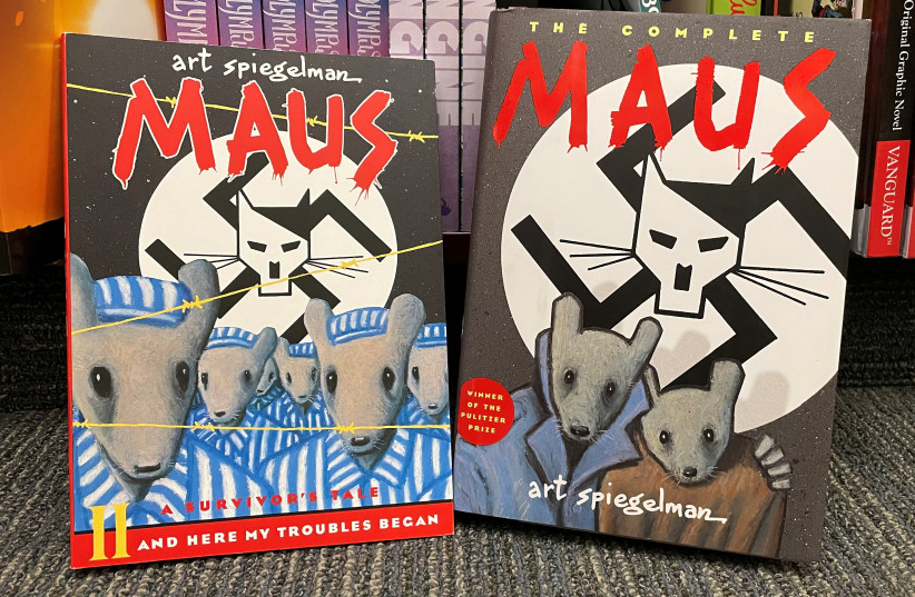  Two books of the graphic novel ''Maus'' by American cartoonist Art Spiegelman are pictured in this illustration, in Pasadena, California, U.S., January 27, 2022. (credit: MARIO ANZUONI/REUTERS)