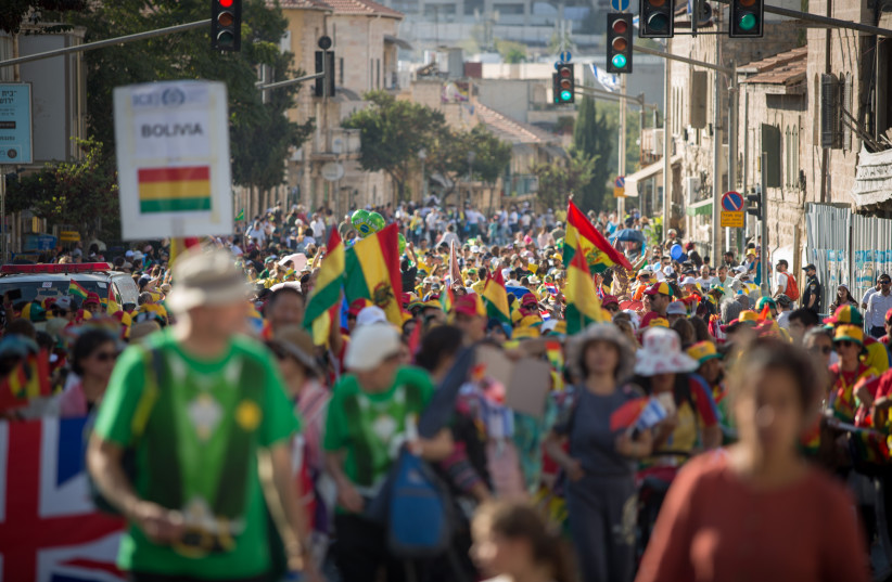  THOUSANDS OF Christian Evangelicals and Israelis march in a parade in central Jerusalem marking the Feast of the Tabernacles, 2018.  (credit: NOAM REVKIN FENTON/FLASH90)