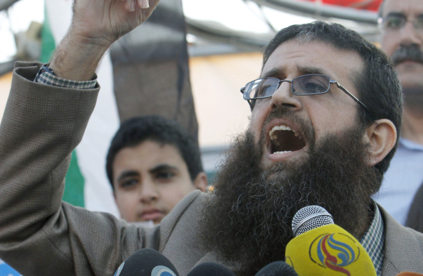  Palestinian Islamic Jihad leader Khader Adnan gestures as he speaks during a rally honoring him following his release, near the West Bank city of Jenin July 12, 2015. (credit: ABED OMAR QUSINI/REUTERS)