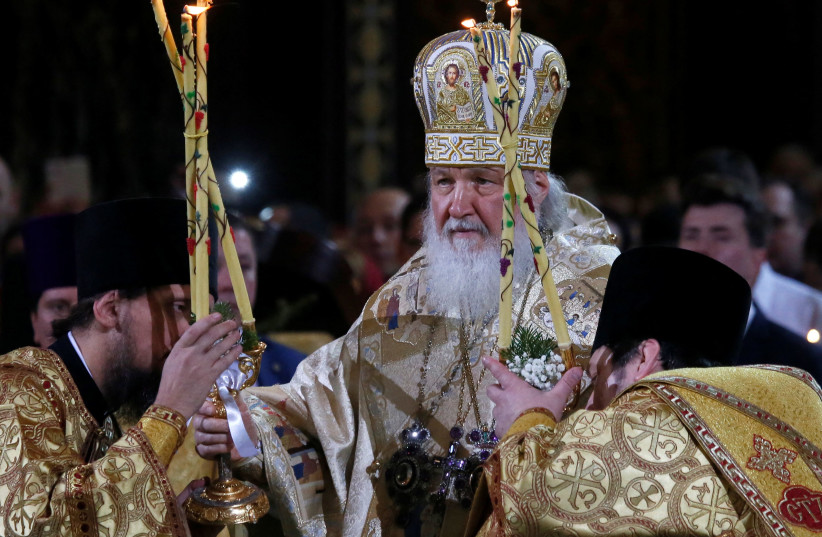   Patriarch Kirill, the head of the Russian Orthodox Church, conducts a service on Orthodox Christmas at the Christ the Saviour Cathedral in Moscow, Russia January 6, 2018. (credit: MAXIM SHEMETOV/REUTERS)