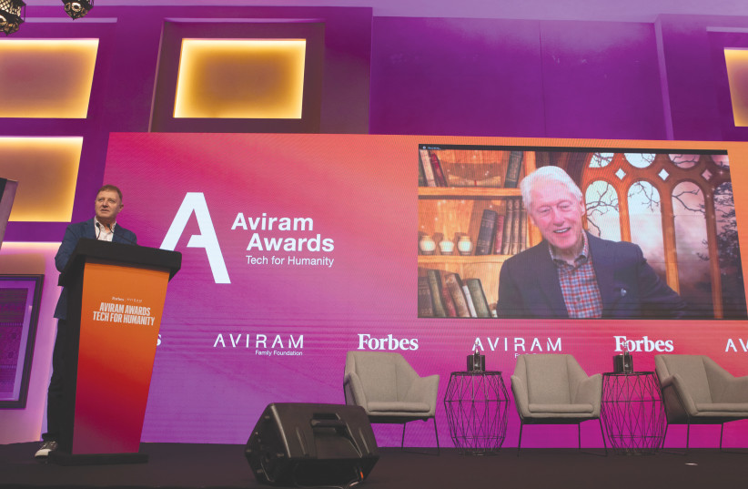  ZIV AVIRAM (left) is seen speaking via Zoom with former US president Bill Clinton at the Aviram Awards ceremony. (photo credit: ELAD GUTMAN)