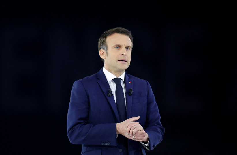 French President Emmanuel Macron, candidate for his re-election in the 2022 French presidential election, attends a political campaign rally at Paris La Defense Arena in Nanterre, France, April 2, 2022. (credit: REUTERS/SARAH MEYSSONNIER)