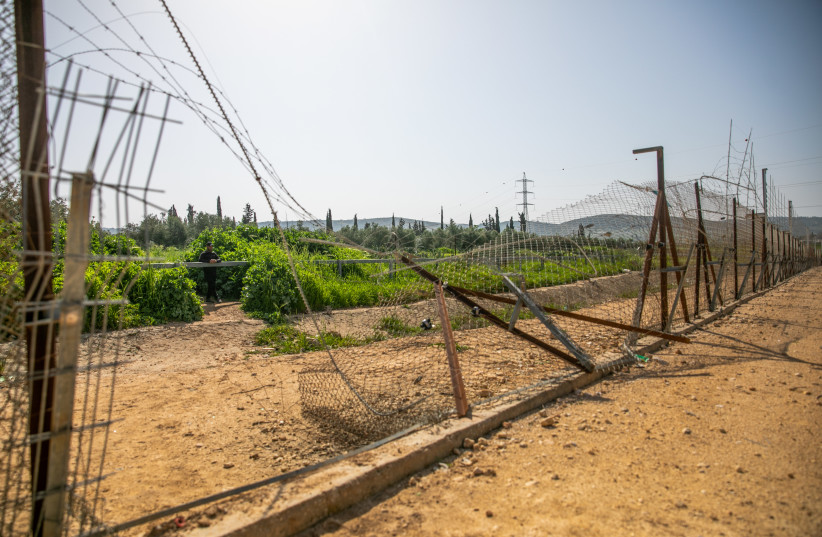 View of a hole in the the security fence, near Mevo Horon, March 30, 2022. (photo credit: YOSSI ALONI/FLASH90)