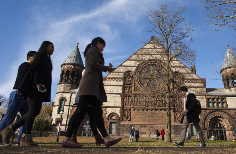 People walk around the Princeton University campus in New Jersey, November 16, 2013. (credit: REUTERS/EDUARDO MUNOZ)