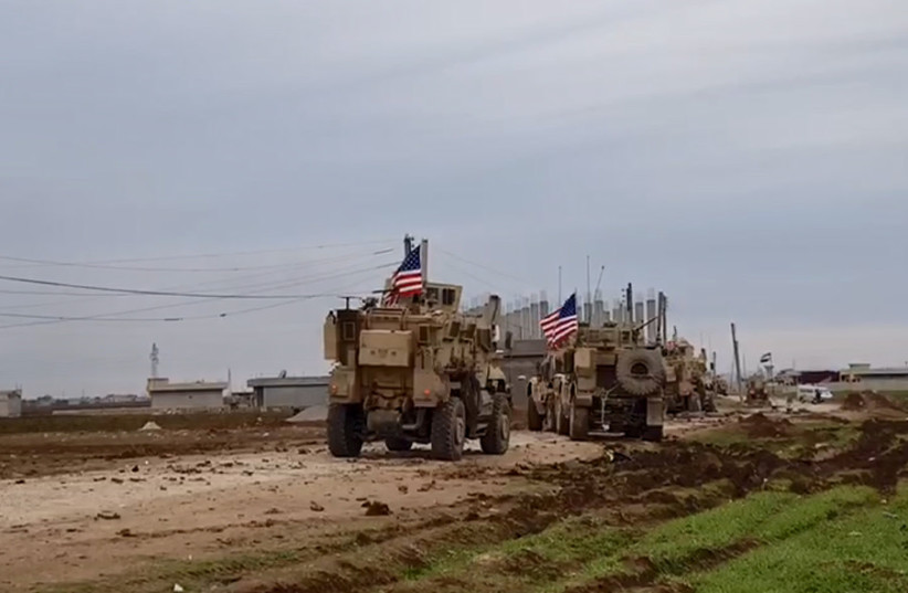  A convoy of US military vehicles moves in the village of Khirbet Amo, near Qamishli, Syria February 12, 2020. (photo credit: SANA/HANDOUT VIA REUTERS)