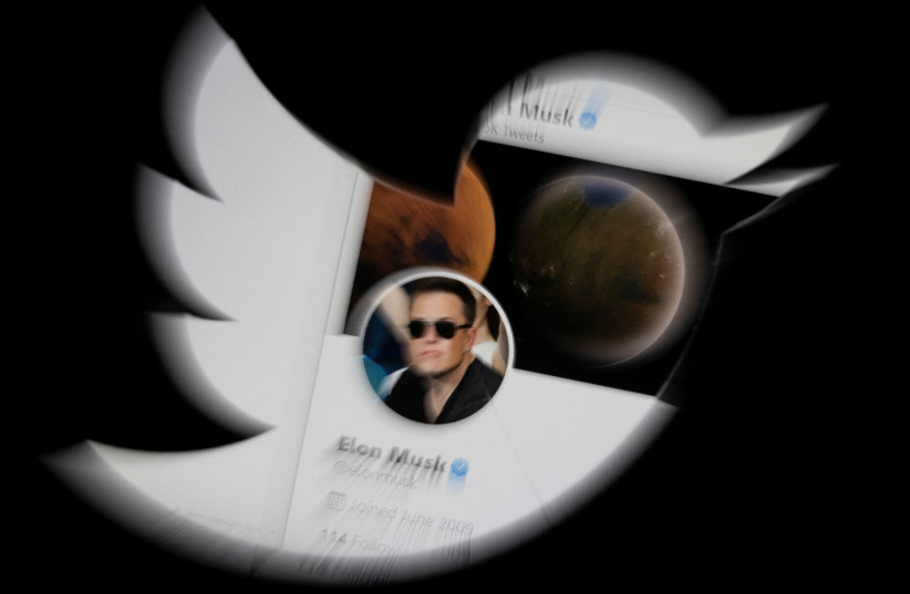  Elon Musk Twitter account is seen through Twitter logo in this illustration taken, April 25, 2022. (credit: DADO RUVIC/REUTERS ILLUSTRATION)