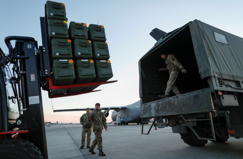  Lithuania's military aid including Stinger anti-aircraft missiles, delivered as part of the security support package for Ukraine, is unloaded from a ?17 Globemaster III plane at the Boryspil International Airport outside Kyiv, Ukraine, February 13, 2022. (credit: REUTERS/VALENTYN OGIRENKO)