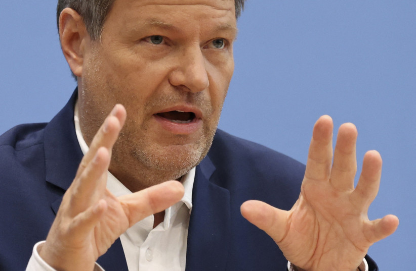  German Economy and Climate Change Minister Robert Habeck gestures during a news conference on measures to reduce the carbon dioxide emissions and Germany's dependance on Russian energy imports amid the Russian war on Ukraine, in Berlin, April 6, 2022. (photo credit: REUTERS/CHRISTIAN MANG)