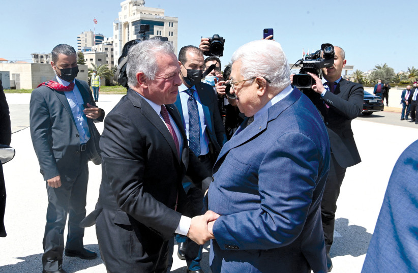  Palestinian Authority President Mahmoud Abbas greets Jordan’s King Abdullah in Ramallah on March 28. (credit: PPO/REUTERS)
