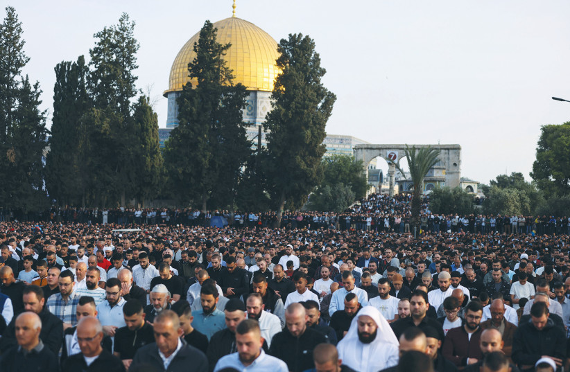  PALESTINIANS ATTEND Eid al-Fitr prayers this week at al-Aqsa. (photo credit: AMMAR AWAD/REUTERS)