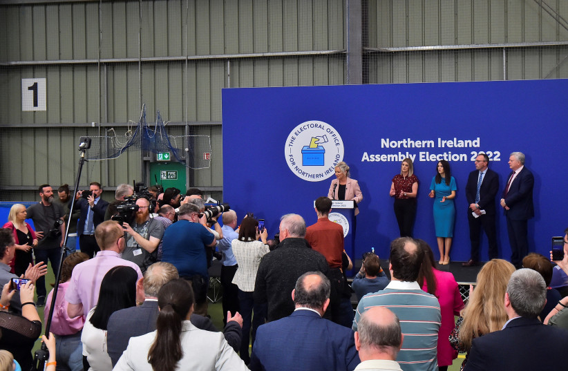 Sinn Fein deputy leader Michelle O'Neill speaks on stage, after Sinn Fein were voted as the largest party in Northern Ireland, at the Meadowbank Sports Arena count centre, in Magherafelt, Northern Ireland, May 7, 2022. (credit: REUTERS/CLODAGH KILCOYNE)