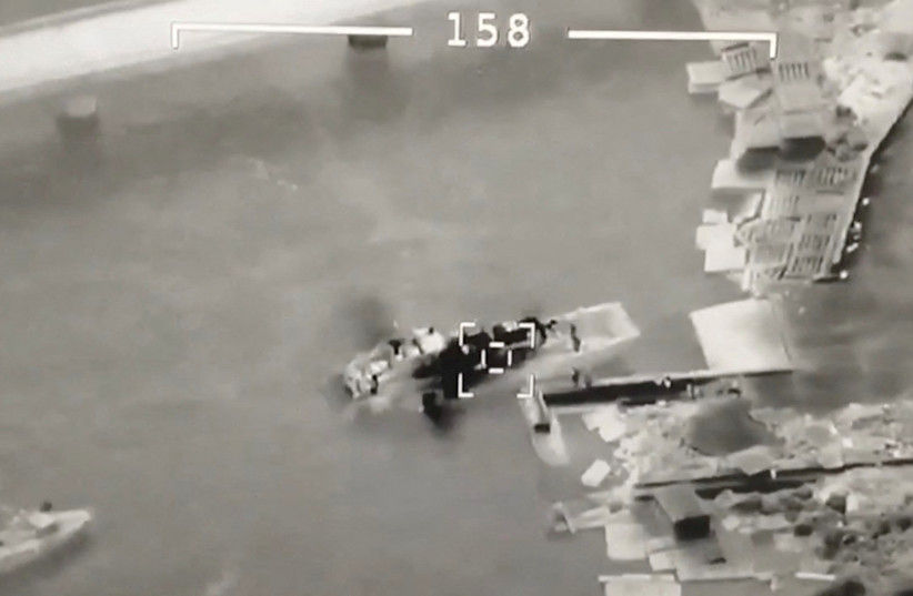 An aerial view shows Ukrainian UAV Bayraktar targeting Russian landing craft vessel at Zmiinyi (Snake) Island, Ukraine, in this still image from a handout video released by Press service of Ukrainian Ground Forces on May 7, 2022.