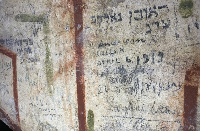  GRAFFITI WITH inscriptions in Hebrew, Yiddish and English, created by visitors from Tel Aviv, Cleveland and Shavli, Lithuania. (photo credit: Courtesy Nahum Schnitzer)