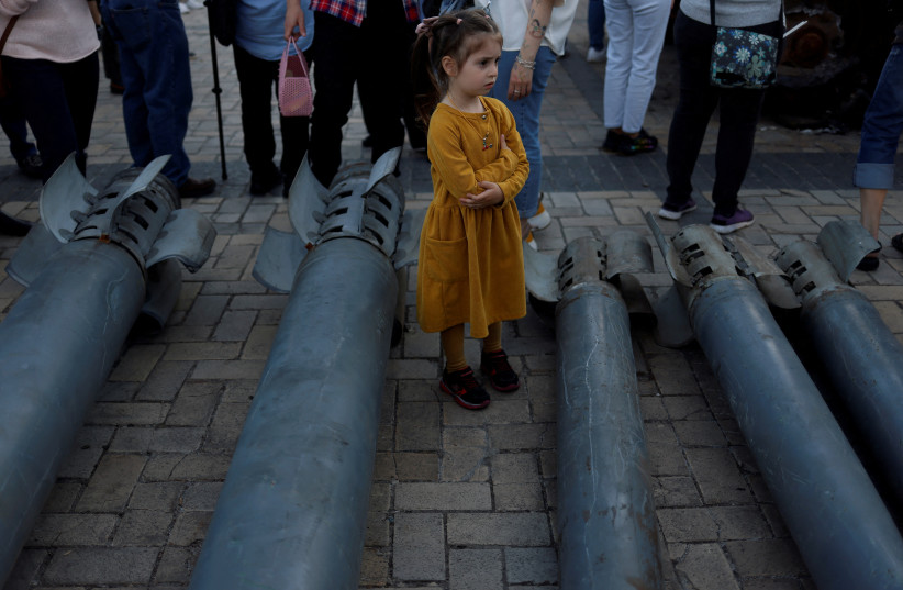  A girl looks on at a display of Russian weapon systems used in their attacks, outside St Michael's Cathedral, as Russia's attack on Ukraine continues, in Kyiv, Ukraine May 29, 2022. (credit: REUTERS)