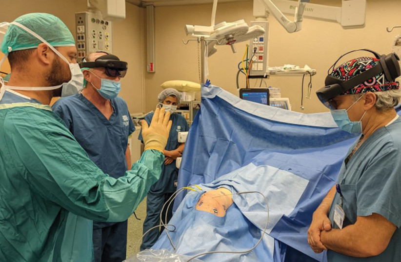  Doctors practice freezing cryotherapy to treat a malignant tumor in the pelvis using a Novarad augmented reality system.  (credit: Levin Center of Surgical Innovation and 3D Printing Unit at Tel Aviv Sourasky Medical Center)