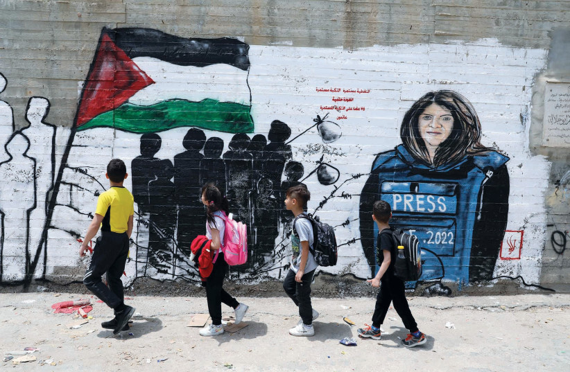  PALESTINIAN CHILDREN walk past a mural of Al Jazeera journalist Shireen Abu Akleh in Bethlehem. (photo credit: WISAM HASHLAMOUN/FLASH90)