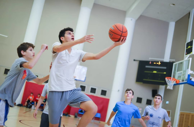  Teens participate in the Tamir Goodman Basketball Camp in Jerusalem in 2021. (credit: JERUSALEM INTERNATIONAL YMCA)