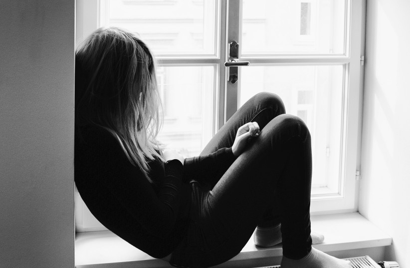 Illustrative image of a teenage girl sitting alone.  (credit: PXHERE)