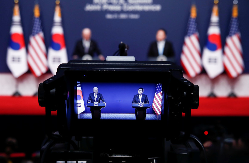  A view of a camera screen shows US President Joe Biden and South Korean President Yoon Suk-yeol during a joint news conference at the Presidential office in Seoul, South Korea, May 21, 2022 (photo credit: JEON HEON-KYUN/POOL VIA REUTERS)