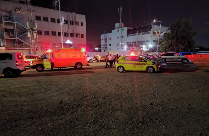  Police and Magen David Adom (MDA) personnel are on the scene of a shooting attack in Lod, Israel, on July 9, 2022. (photo credit: MDA SPOKESPERSON)