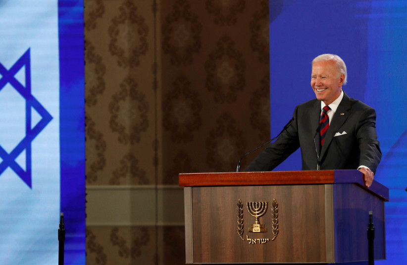 US President Joe Biden speaks during a news conference with Israeli Prime Minister Yair Lapid (not seen) at Waldorf Astoria Hotel in Jerusalem, Israel July 14, 2022 (credit: ATEF SAFADI/POOL VIA REUTERS)