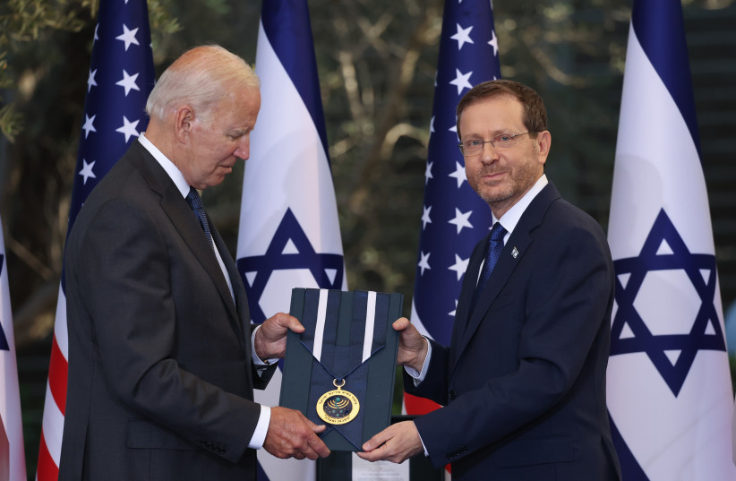  President Isaac Herzog presents the Presidential Medal to US president Joe Biden at the president Residence in Jerusalem. on July 14, 2022. Joe Biden on his first official visit to Israel since becoming US president.  (credit: YONATAN SINDEL/FLASH90)
