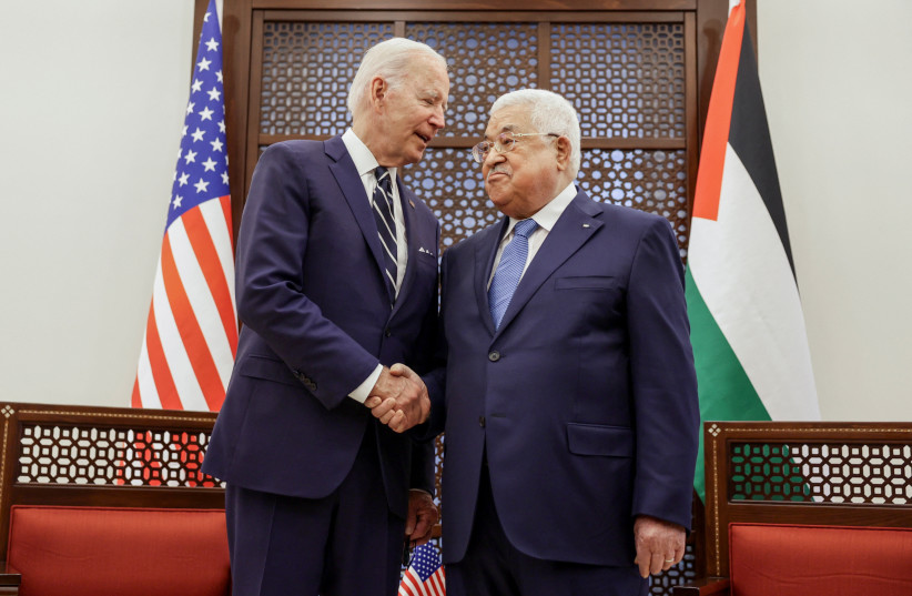  US President Joe Biden shakes hands with Palestinian President Mahmoud Abbas at the Presidential Compound, in Bethlehem, in the West Bank July 15, 2022 (credit: REUTERS/EVELYN HOCKSTEIN)