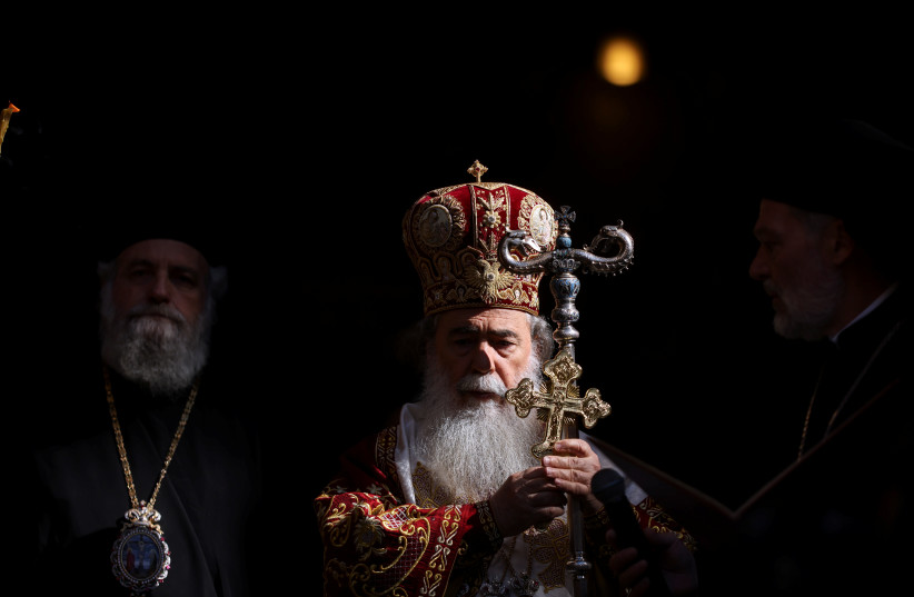  Greek Orthodox Patriarch of Jerusalem Theophilos III leads the ''Washing of the Feet'' ceremony on Easter Holy Week in the Church of the Holy Sepulchre in Jerusalem's Old City, April 21, 2022.  (credit: REUTERS/AMMAR AWAD)