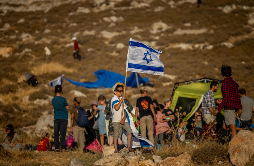  Settlers of the Nachala Settlement Movement set up tents near Kiryat Arba, with the intention to establish illegal outposts in Judea and Samaria, July 20, 2022. (credit: YONATAN SINDEL/FLASH90)