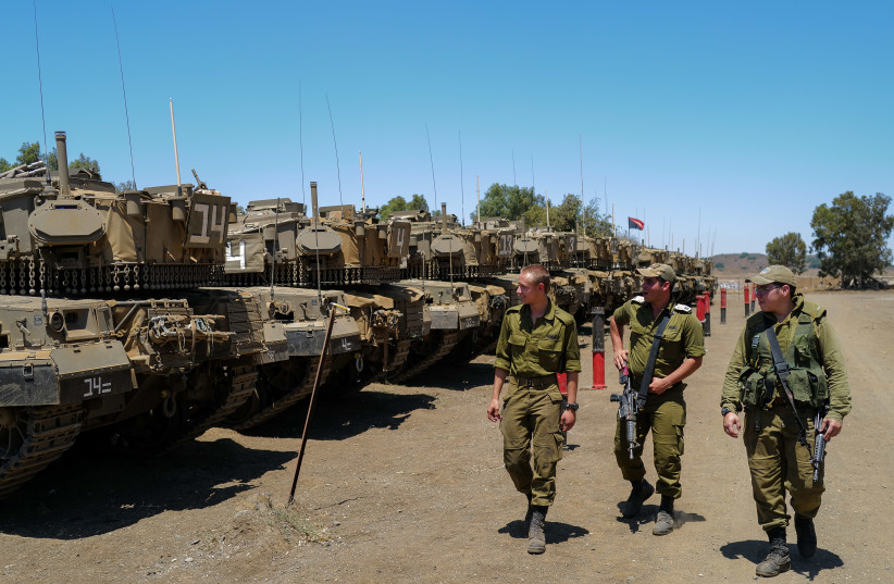  Israeli tanks seen near the Israeli-Syrian border in the northern Golan Heights, on July 22, 2022.  (credit: MICHAEL GILADI/FLASH90)