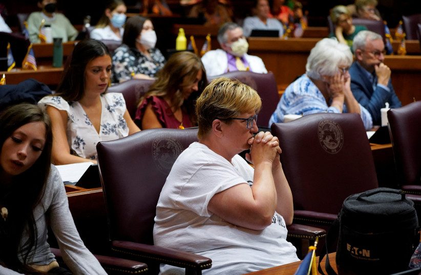 People react during public testimony in the Indiana House of Representatives during a special session to debate banning abortion in Indianapolis, Indiana, US, August 2, 2022. (credit: REUTERS/Cheney Orr)
