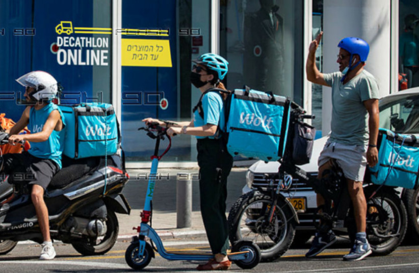  WOLT FOOD delivery drivers in Tel Aviv.  (photo credit: MIRIAM ALSTER/FLASH90)