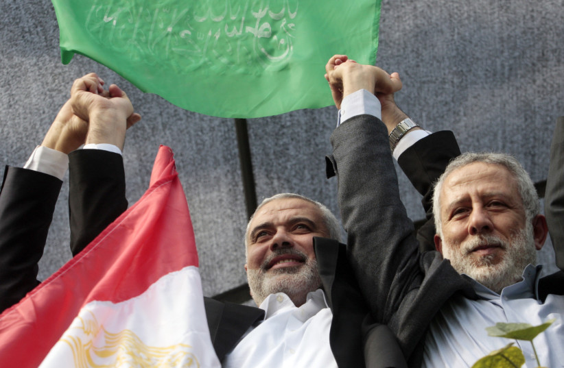  Senior Hamas leader Ismail Haniyeh (L) and Islamic Jihad leader Mohammed Al-Hindi (credit: REUTERS/AHMED ZAKOT)